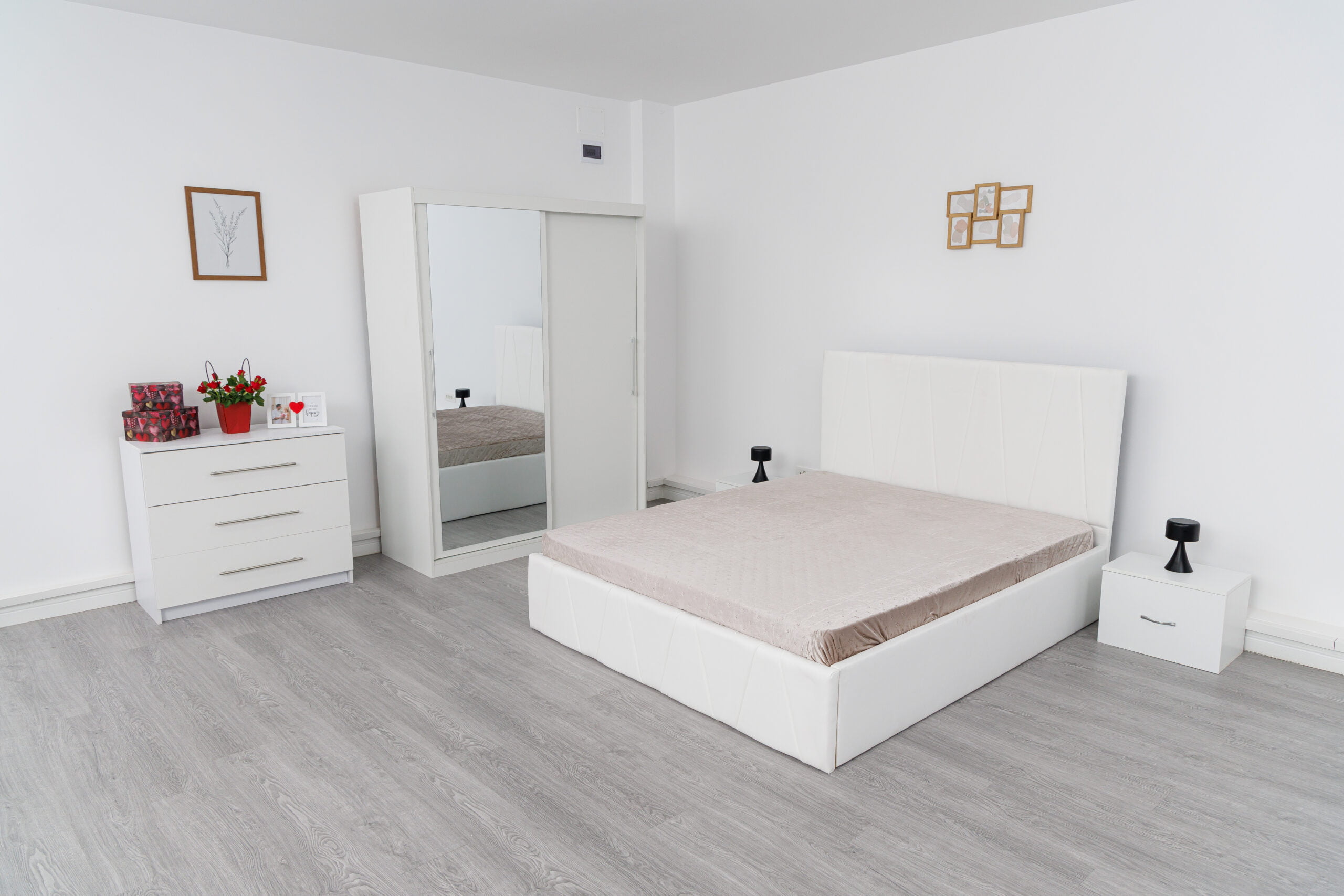 Image_0491-scaled-2.jpg Dormitor Eric Alb cu Pat Tapitat Alb Stofa Dulap Usi Glisante 150 x 200 cm Alb cu oglinda Noptiere si Comoda TV - imagine 1